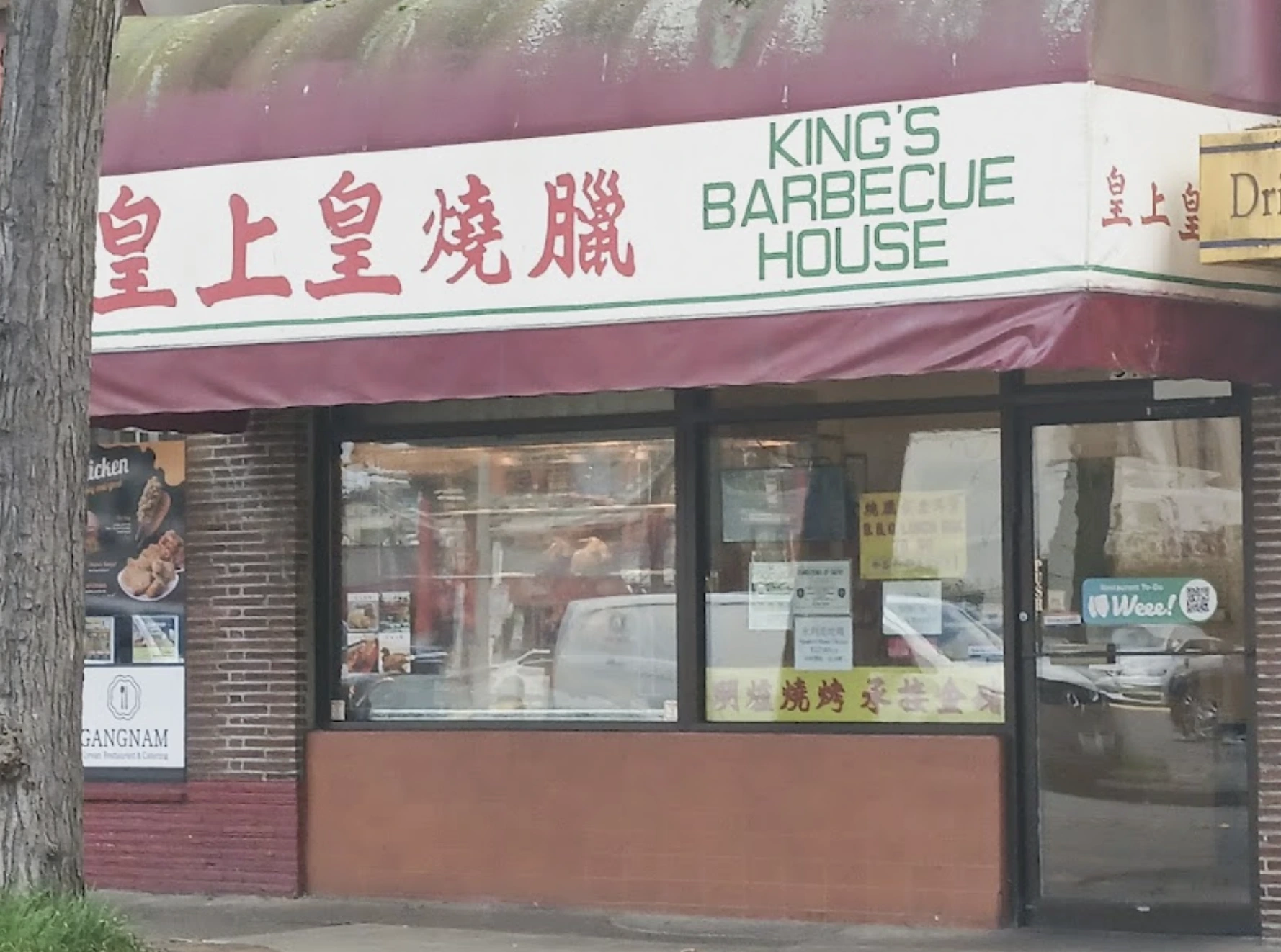 Glazed Cantonese barbecue meats hanging in the window at King's Barbeque House